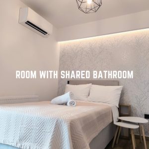 Room with shared bathroom